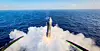 Her lander Starship i havet. I forgrunnen sees propellen på dronekameraet.