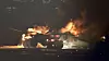 Et Japan Airlines-fly i flammer på Haneda-flyplassen i Tokyo.