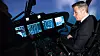 Justisminister Per-Willy Amundsen i CAEs AW101-simulator som befinner seg hos Thales Norway på Utsola. Bilde: Eirik Helland Urke