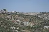 Den israelske bosetningen Bruchin regnes som ulovlig etter folkeretten, da den er på den okkuperte Vestbredden. Ved siden av ligger den palestinske landsbyen Bruqin.