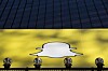 Logoen til Snapchat vises på Times Square i New York. Mobilapplikasjonen har hatt enorm vekst siden starten.
