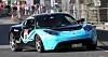 Eidsiva Energi i sin lekre vannkraftdekorerte Tesla Roadster.