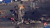 In this photo provided from a frame grab from Tulsa's KOTV/NewsOn6.com, fires burn at an eastern Oklahoma drilling rig near Quinton, Okla., Monday Jan. 22, 2018. Five people are missing after a fiery explosion ripped through a drilling rig, sending plumes of black smoke into the air and leaving a derrick crumpled on the ground, emergency officials said. (Christina Goodvoice, KOTV/NewsOn6.com via AP)