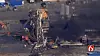In this photo provided from a frame grab from Tulsa's KOTV/NewsOn6.com, fires burn at an eastern Oklahoma drilling rig near Quinton, Okla., Monday Jan. 22, 2018. Five people are missing after a fiery explosion ripped through a drilling rig, sending plumes of black smoke into the air and leaving a derrick crumpled on the ground, emergency officials said. (Christina Goodvoice, KOTV/NewsOn6.com via AP)