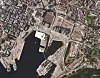 Kvadraturen i Oslo (til venstre i bildet) består av mange eldre murbygninger fundamentert på treflåter. Foto: Norge i bilder, Kartverket, GE
