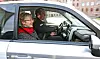 Liv Signe Navarsete fikk den første turen i de nye thinkdrosjene. Bak rattet: Audun Asphjell, daglig leder i Ecotaxi.