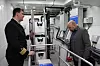 Maskinsjef David Westrgård Jonassen og Sverre Eriksen (DNV GL) ser i maskinrommet med permanentmagnetmotor og gir. Batterirom og tavler er i et annet rom. Foto: Tore Stensvold