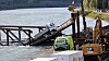 Bruseksjonen med en lastebil på tas ned under opprydning etter at Tretten bru kollapset i Gudbrandsdalslågen og over E6.