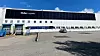 De svarte fasadepanelene utgjor om lag en tredel av solcelleanlegget på Møller-gruppens logistikkbygg i Lillestrøm.