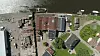 Oversiktsbilde over gårdsplass, bygningsmasse og kaifront under restaurering. Foto: Glasopor