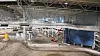 Fra taket henger det en 1000 meters lang langrennsløype i Snø, den nye innendørs skihallen på Lørenskog. Her har det vært utfordrende å unngå konflikt mellom heis, langrennsløype og bygg.