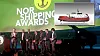 Vinnerne av Norshipping Awards på scenen sammen med kong Harald under Norshipping 2015. Tore Ulstein (med mikrofonen i hånda) takker for prisen 'Next generation ship award'.
