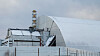 En gigantisk metallkonstruksjon er plassert over den gamle sarkofagen som dekker den ødelagte 4. reaktoren på Tsjernobyl-kraftverket. Bildet er tatt 29. november 2016.