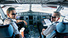 Kaptein og sjefsflyver Johan Boström og styrmann Johan Nyman i cockpit på Novairs splitter nye A321 Neo. Foto: Eirik Helland Urke