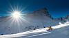 Girl telemark skiing snow slope in mountains