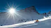 Girl telemark skiing snow slope in mountains