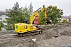 Elektrisk gravemaskin i gang med ny miljøgate på Gran på Hadeland.
