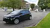 Elbil parkert på et ladested på Danmarks plass i Bergen.