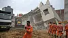 Redningsmannskaper jobbet gjennom natta for å rydde ruinene etter at to bygninger kollapset utenfor New Delhi i India. Så langt er tre personer funnet døde.