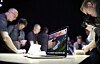 NORDNORSK: Journalister fra hele verden flokker seg rundt nye Macbook, som prydes av vakker vesterålsnatur fotografert av Stian Klo.