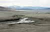 FØLELSESLADET: Det store fjellvannet Tesse i Lom kommune er redusert til en liten dam omgitt av en ørken av stein og sand. Fem ordførere har jobbet for å endre dette bildet.
