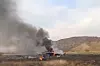 Røyk stiger opp fra vraket der et tyrkisk C-130 Hercules-fly styrtet i Georgia tirsdag. Bildet er hentet fra en video.