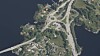 Dagens parkeringsplass er midt i biletet, like ved rundkøyringa. Ny parkeringsplass blir rett sør for denne.