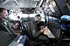 Flight deck: Maskinist Jan Arne Hanssen har klart å forsere køen ved den ene fungerende ovnen om bord, og kan spise middag på vei hjem til Tyskland.