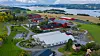 Mære landbruksskole er nå et av ni pilotprosjekt i FME ZEN (Forskningssenter for nullutslippsområder i smarte byer). I løpet av de senere årene har skolen fått et nærvarmeanlegg basert på energihøsting fra tomatveksthus, nytt melkefjøs i tre som er naturlig klimatisert, et ammekufjøs med takintegrert solcelleanlegg og et hybelbygg med passivhusstandard og solceller.