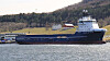 Troms Artemis , her avbildet foran Elpros fasiliteter i Trondheimsfjorden, er ett av skipene som allerede mottar landstrøm via det nyvinnende landstrømsystemet. Foto: Svein Jarle Moen