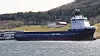 Troms Artemis , her avbildet foran Elpros fasiliteter i Trondheimsfjorden, er ett av skipene som allerede mottar landstrøm via det nyvinnende landstrømsystemet. Foto: Svein Jarle Moen