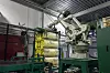 Fem pakker Glava til én pakke som komprimeres ytterligere, før en stor robotarm laster pakkene på en pall. Foto: TU Story Labs