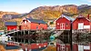 Traditional Norwegian red wooden barns stand on the sea coast. Snillfjord, Sor-Trondelag region, Vingvagen fishing village