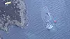 KNM Helge Ingstad ligger nesten helt under vann etter at flere vaiere som har stabilisert skipet, har røket. Foto: Kystverket/NTB Scanpix