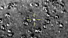 Et bilde fra NASA-sonden New Horizons viser Ultima Thule, markert i midten. Første nyttårsdag flyr New Horizons tett forbi det 30 kilometer store objektet i det såkalte Kuiperbeltet, et fjerntliggende område som strekker seg fra Neptuns bane og utover.