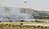 Redningsmannskaper, brannbiler og helikoptre omringet Barajas flyplass i Madrid etter at et fly skled av rullebanen onsdag 17. september. 153 mennesker skal ha mistet livet i ulykken.