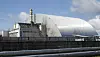 Skjoldkonstruksjonen over den eksploderte reaktoren ved Tsjernobyl-kjernekraftanlegget i Ukraina, slik den så ut i april 2021. Foto: AP Photo/Efrem Lukatsky
