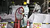 Arbeidere med beskyttelsesdresser jobber ved den ødelagte atomkraftverket Fukushima Daiichi i Japan. Arbeidet med å rydde opp og avvikle atomkraftverket etter katastrofen vil ta 30–40 år og koste enorme beløp.