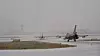 De to F-16 beredskapsflyene på vei ut fra shelterne på Bodø flystasjon. Foto: Eirik Helland Urke