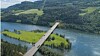 Etter kryssing av Lågens hovedløp passerer brua over Våløya før den går inn på Hovemoen. Nordre landkar er plassert slik at eksisterende landbruksvei/turvei kan legges under brua.