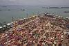 Tette trafikk både til sjøs og på en av containerhavnene i Singapore. Bilde: Tore Stensvold