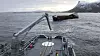 Kystvaktskipet KV Harstad bistår med å klargjøre Hagland Captain for slep i Hustadvika. Båten finkk motostopp lørdag kveld i det dårlige været.
