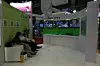 TIL Å SOVNE AV: Noen av deltagerne på Broadband World Forum var så lite imponert over IPTV at de rett og slett sovnet i sofaen foran TV-veggen. Det er ikke alle nye teknologier som fenger like mye. I Beijing var definitivt ikke IPTV det som trakk mest folk til standene.