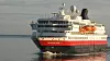 Hurtigrutens MS Nordnorge like ved Lofoten. Om noen år kan det være et nullutslippsskip som trafikkerer kystruta. Bilde: Tore Stensvold