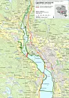 Utgrensing: Det grønne omrisset viser hele Lågendeltaet naturreservat med en utstrekning på 7230 dekar. Det lille røde området cirka midt på kartet viser det 27 dekar store området Statsforvalteren i Innlandet foreslås utgrenset for å kunne bygge motorveibrua. Illustrasjon: Statsforvalteren i Innlandet