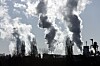 smoking chimney of an industrial company. Pollution and waste gases Klimaendringer. Global oppvarming. Illustrasjonsfoto