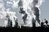 smoking chimney of an industrial company. Pollution and waste gases Klimaendringer. Global oppvarming. Illustrasjonsfoto