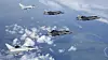 To amerikanske og ett britisk F-35B møtes av to britiske Eurofighter Typhoon på vei til England i juni. Foto: RAF