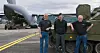 Harald Hend (f.v) i Ritek, major Albert Albertsen fra Kampvognprosjektet og Håkon Røvik i Ritek ved den første CV-90-en som leveres inn til moderniseringsprogrammet. Panservognen ble fraktet til Værnes sist lørdag i et C-17 transportfly.