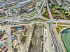 Foran: Byggegropa til Nordhavnstunnelen. I bakgrunnen skimter vi portalene til den 730 meter lange Nordhavnvejstunnelen. Etter hvert blir de to tunnelene som én. Foto: Vejdirektoratet